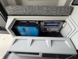 Inside an RV rental: Victron inverter/charger & Battle Born LiFePO4 battery providing reliable power.