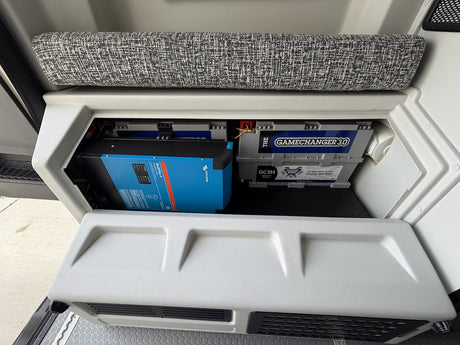 Inside an RV rental: Victron inverter/charger & Battle Born LiFePO4 battery providing reliable power.