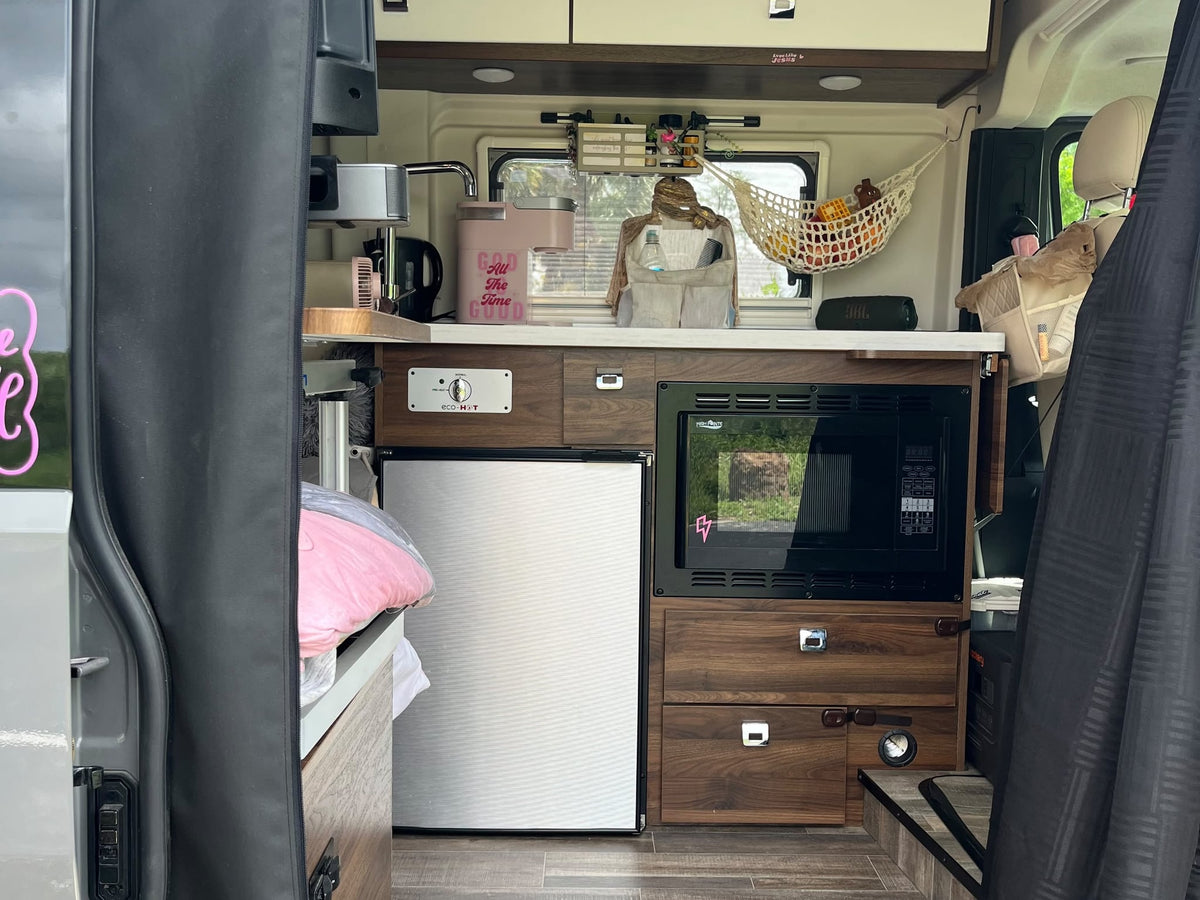  and charging ports. 86°F outside.|Front of a gray Winnebago Ram Promaster RV rental — photo 13