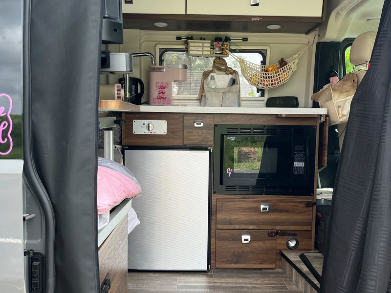  and charging ports. 86°F outside.|Front of a gray Winnebago Ram Promaster RV rental — photo 13
