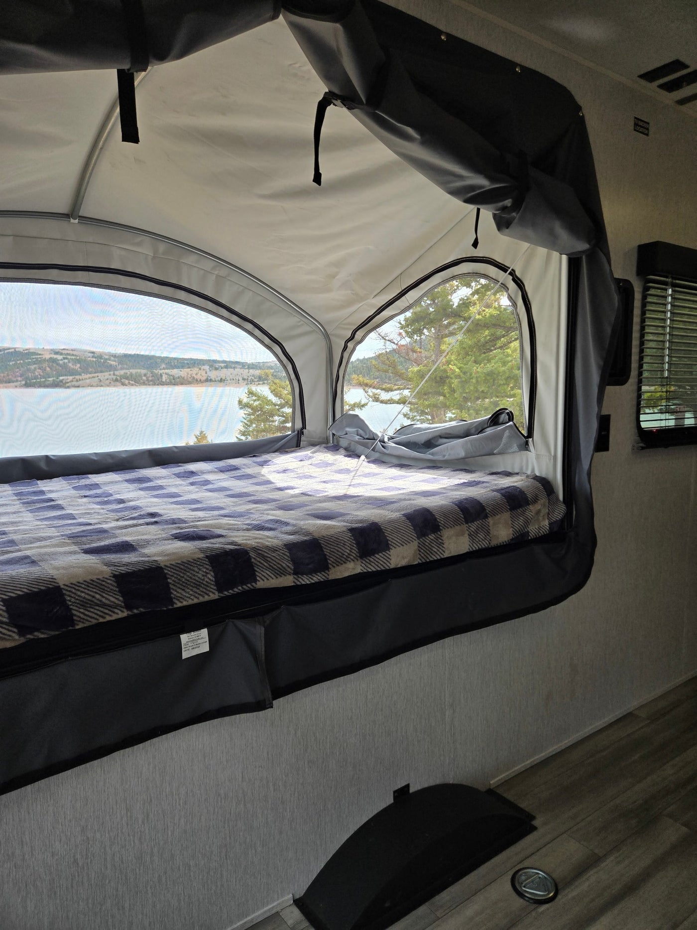  and a solar panel for camping.|Relaxing at a scenic rv rental campsite by the lake. Travel trailer — photo 5