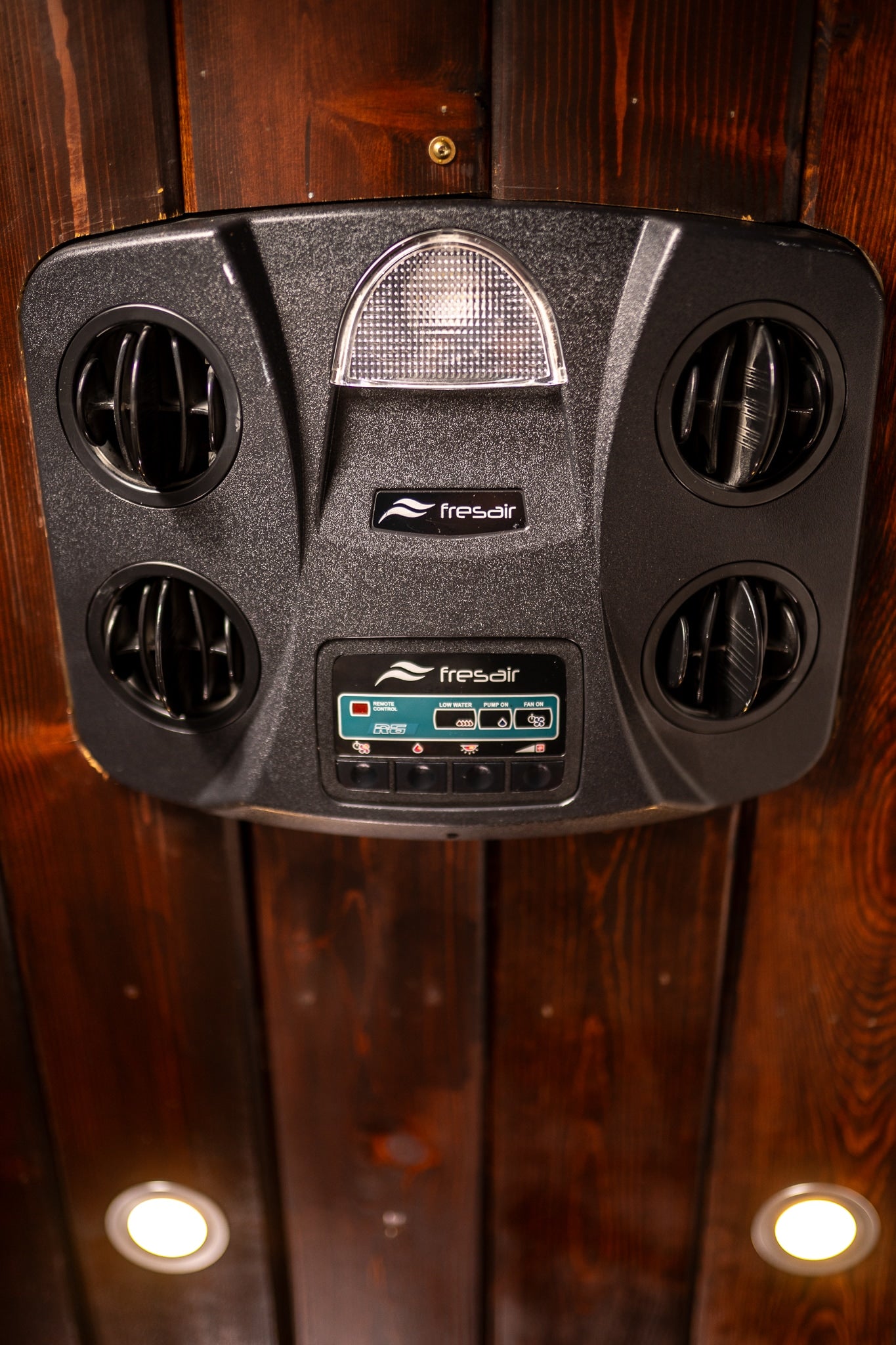 Fresair RV climate control unit with air vents, integrated light, and controls for AC/heating. Essential comfort in your RV rental.