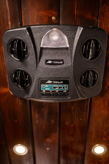 Fresair RV climate control unit with air vents, integrated light, and controls for AC/heating. Essential comfort in your RV rental.