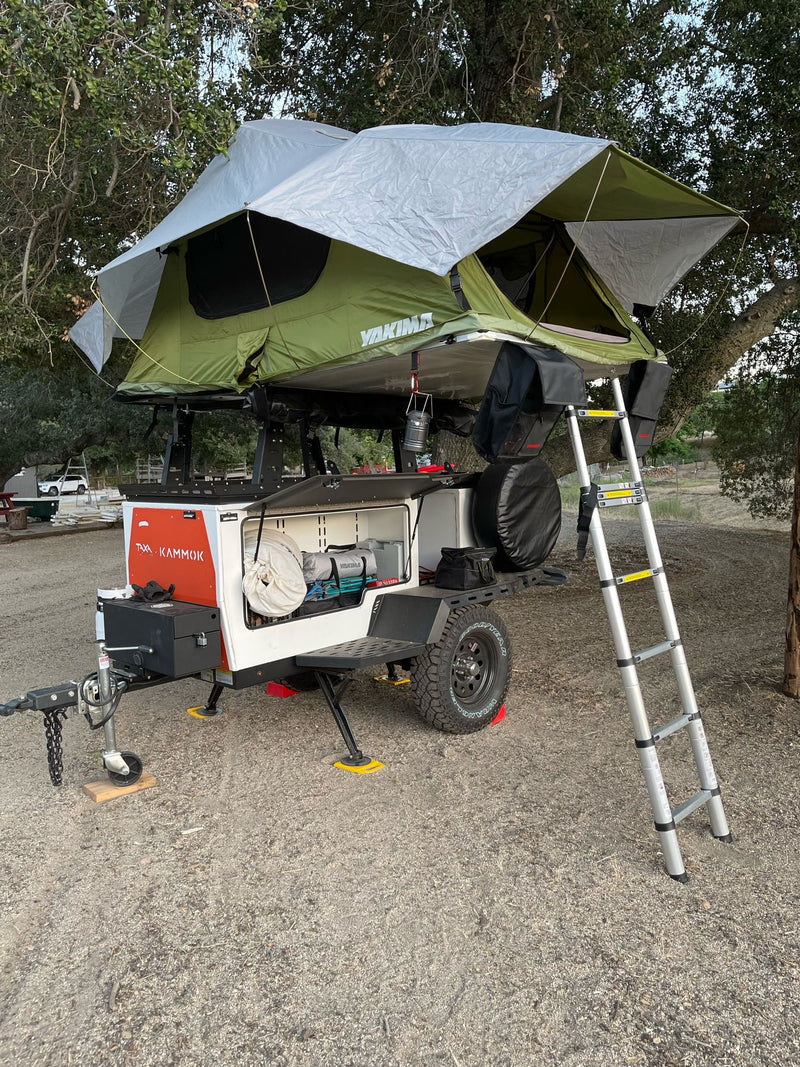  and cooler for rugged adventures.|Off-road RV rental camping setup: trailer with rooftop tent — photo 3