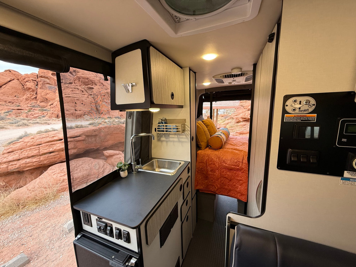  and outdoor red rock scenery.|Elevated view of a stunning desert campground with red rock formations — photo 36