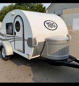 A compact white T@G teardrop travel trailer, ideal for your next rv rental. Modern RV with sleek design.