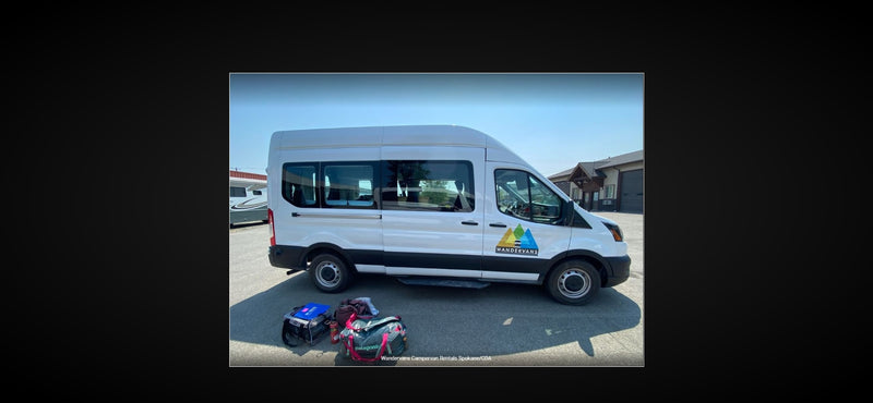 White Wandervans campervan with colorful bags, parked and ready for an RV rental. Perfect for your next travel adventure! — photo 5