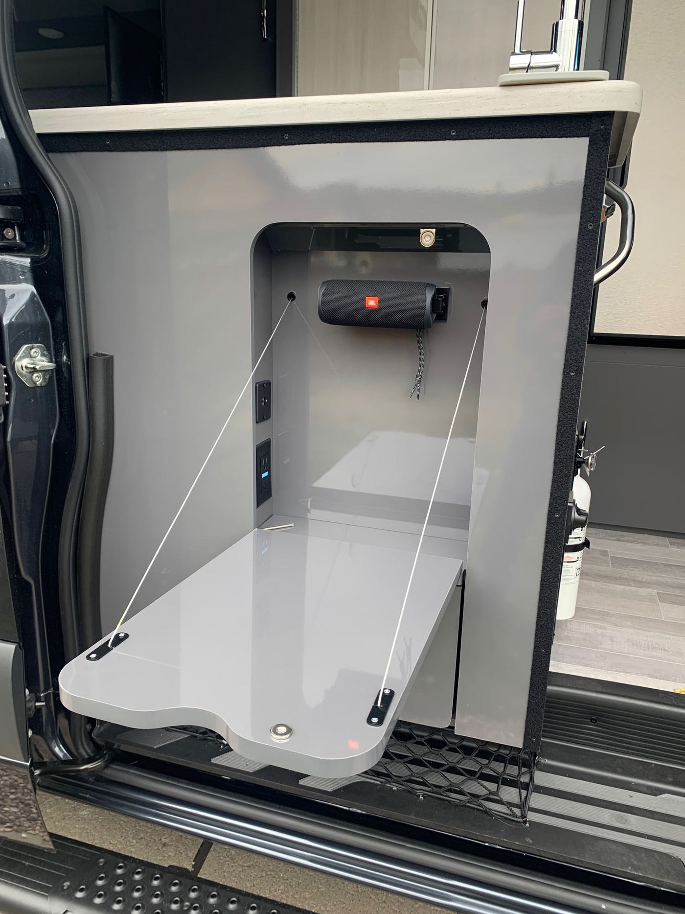  and refrigerator.|Dark gray camper van — photo 13