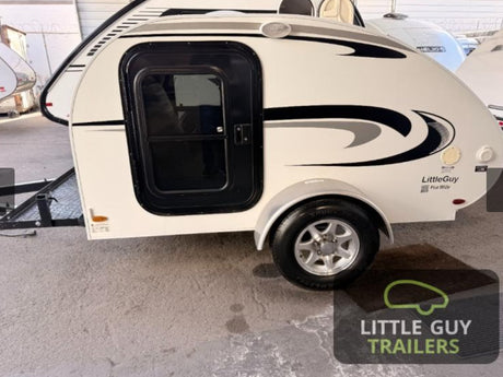 Compact white Little Guy teardrop RV rental