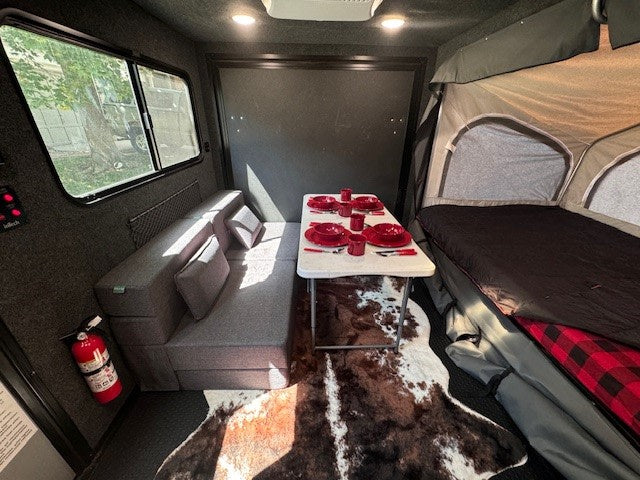  and durable flooring.|This RV rental's toy hauler garage features a durable floor — photo 16