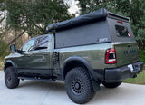 This rugged Ram Power Wagon pickup, equipped with an overland Go Fast Camper, is perfect for your next off-road adventure or RV rental.