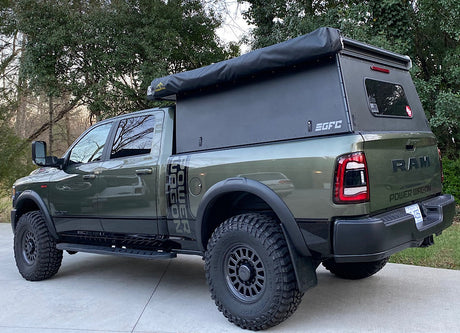 This rugged Ram Power Wagon pickup, equipped with an overland Go Fast Camper, is perfect for your next off-road adventure or RV rental.