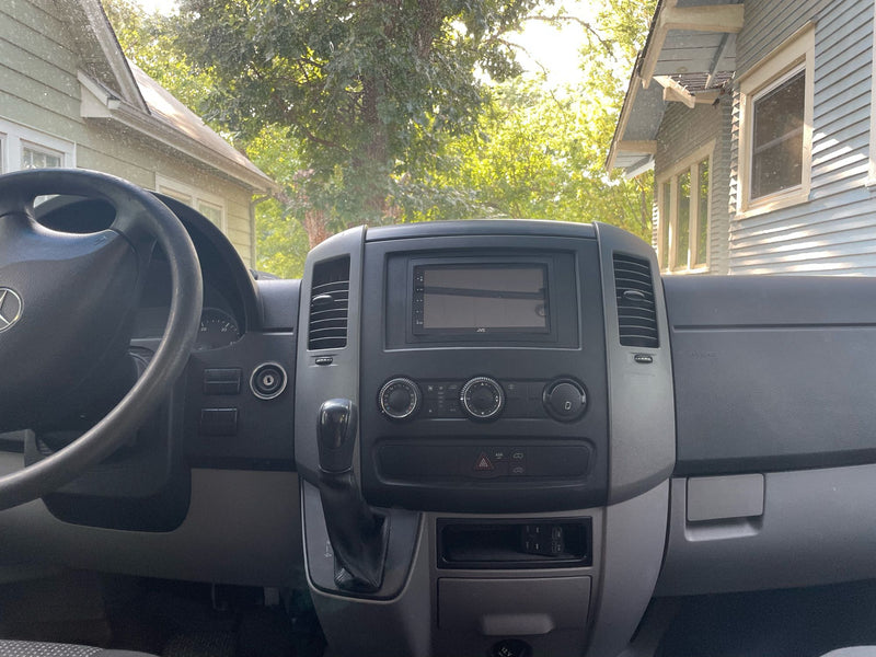  secured in an RV rental van interior. Ready for travel.|Spacious RV rental interior with a compact kitchen — photo 10