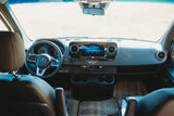 Inside an RV rental: detailed view of the modern Mercedes van dashboard & cockpit, ready for adventure.