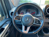 Inside an RV rental: Mercedes-Benz Sprinter dashboard with steering wheel controls, gauges, and digital display showing 51079 miles.