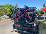 Oregon RV rental van from Bend Campervans with two Cannondale F500 mountain bikes on a rear rack.