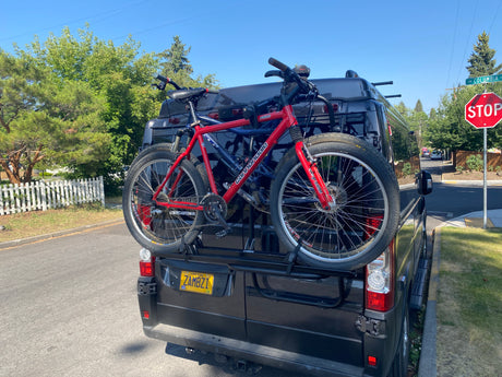 Oregon RV rental van from Bend Campervans with two Cannondale F500 mountain bikes on a rear rack.