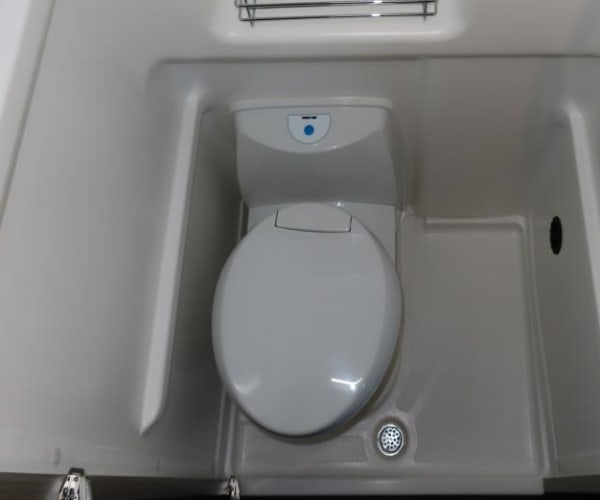  and pop-top access.|View inside an RV rental. Features a long fabric bench seat — photo 14