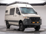 This custom Mercedes Sprinter van, ready for adventure, is an ideal rv rental. Features off-road tires, roof rack & awning.