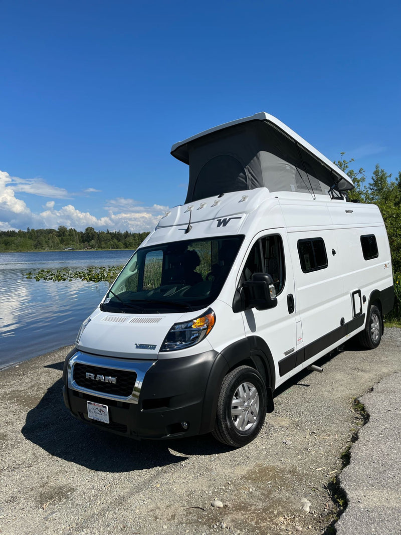 White Winnebago RV rental camper van with pop-top roof extended — photo 1