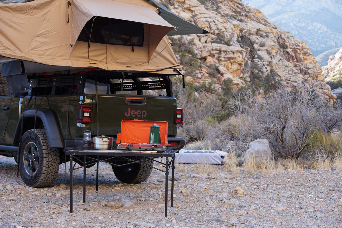 Jeep Gladiator with rooftop tent, perfect for an rv rental adventure. Overlanding setup, camp kitchen in scenic desert. — photo 6