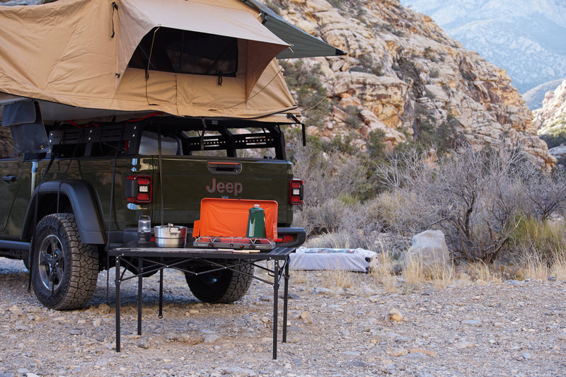 Jeep Gladiator with rooftop tent, perfect for an rv rental adventure. Overlanding setup, camp kitchen in scenic desert. — photo 6