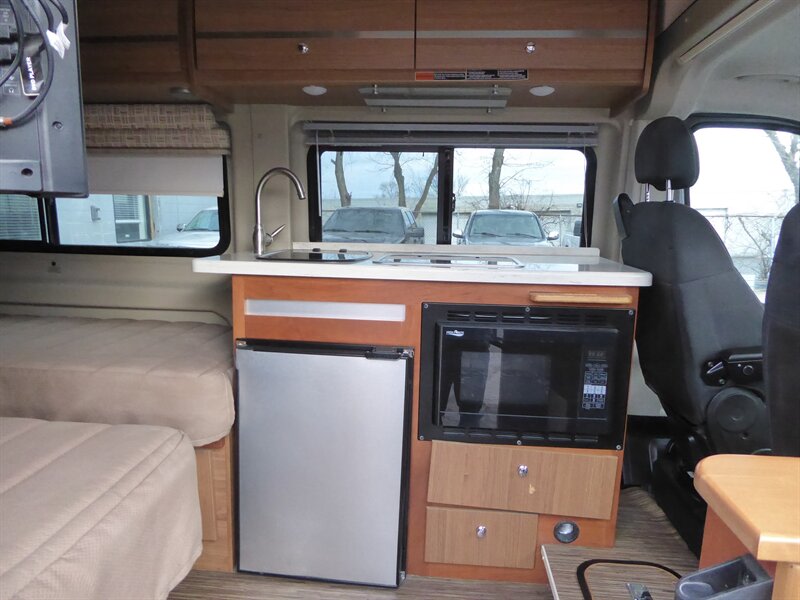  plus overhead storage. Perfect for travel.|Inside this rv rental: twin beds flank an aisle — photo 14