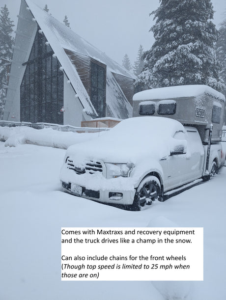 Snow-covered Scout truck camper RV rental (F-150). This rig is a champ in the snow, perfect for winter adventures!