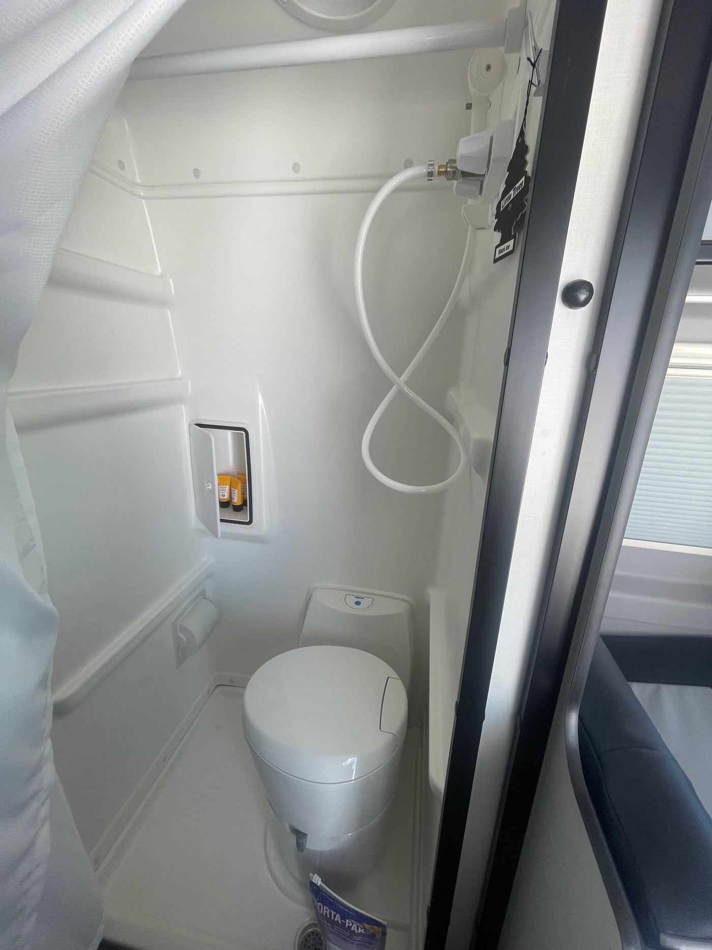  and table on the vast salt flats.|Gray Mercedes Sprinter RV rental with awning & chairs on a vast salt flat — photo 13