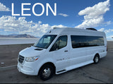 "LEON," a white Mercedes Sprinter Class B RV rental, parked by salt flats with mountains under cloudy skies.
