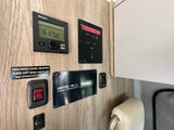 RV rental control panel: Truma, Winnebago tank, and Xantrex solar systems. Manage heat, water, and power.