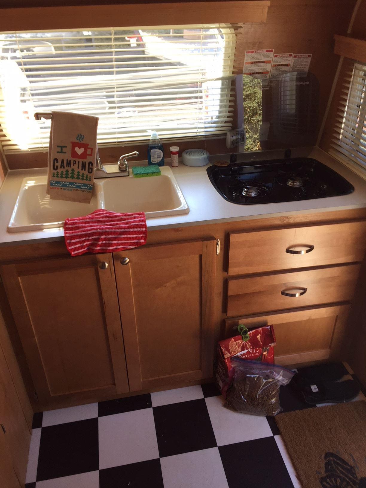  a gray and red travel trailer — photo 2