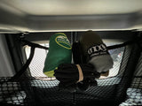 RV rental overhead storage: Chillax & Eno hammocks with rope, secured in a cargo net. Gear organized for travel.