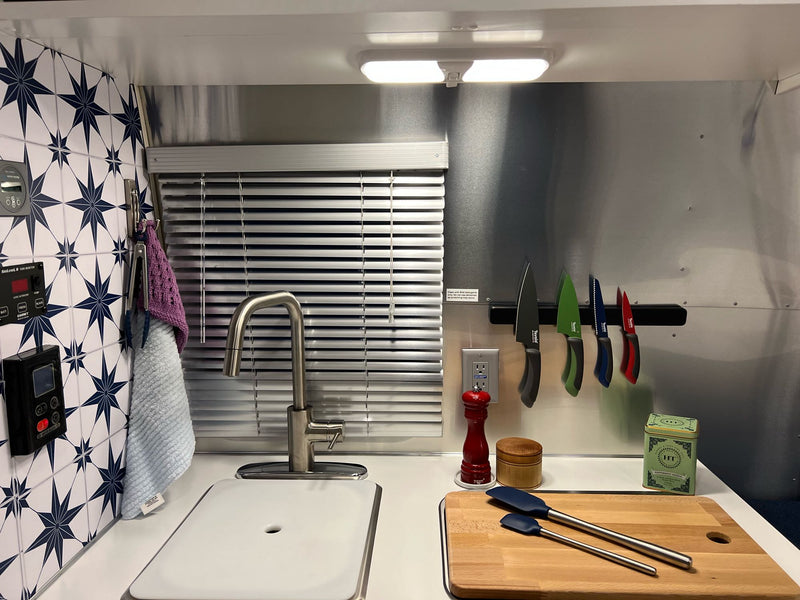  and compact bath. Perfect for travel.|Cozy RV rental evening: red wine — photo 12