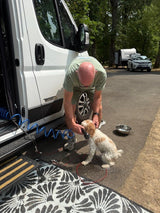 Handy place to wash off muddy boots, sandy feet, and dirty paws! Maggie gets her paws washed off with warm water before entering the van. 