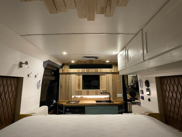  and cozy seating. Ready for adventure!|Modern RV rental conversion: L-shaped sofa