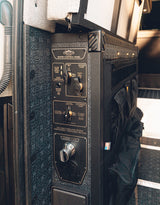 RV rental: Storyteller Overland's water control panel for camper vans, detailing fresh water, city hookup, and outdoor shower.