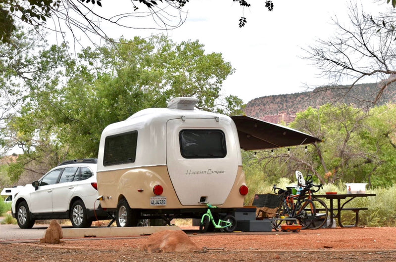  compact travel trailer with off-road tires and bike rack — photo 4