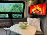 Enjoy a cozy rainy day in this rv rental, complete with a virtual fireplace on the TV and hot tea.