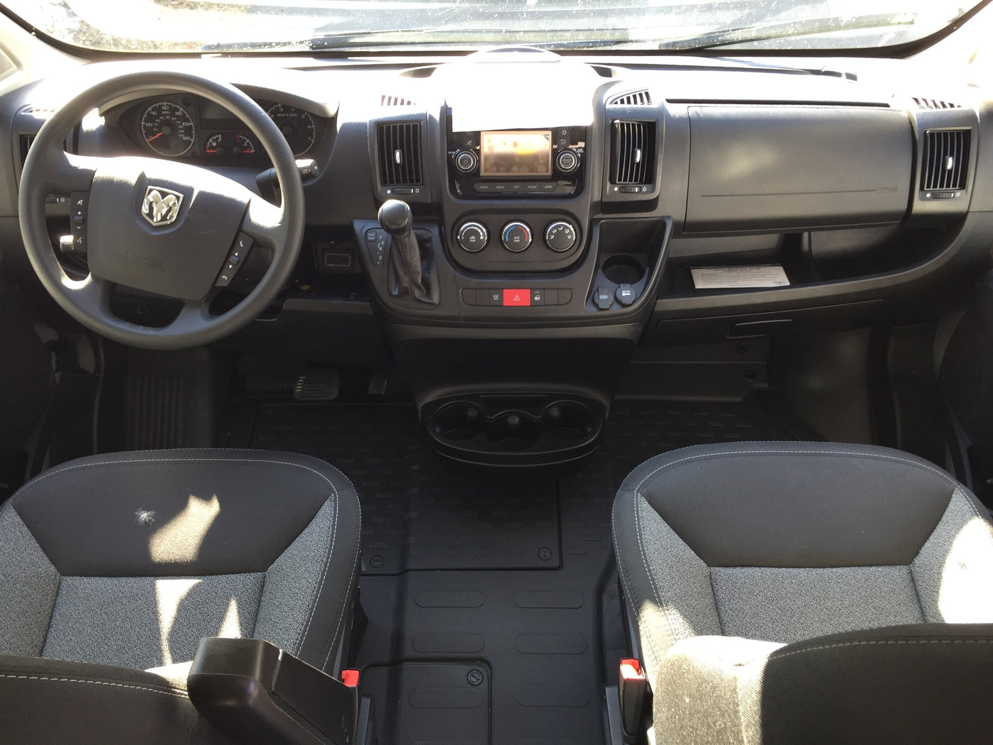  with open side door. This RV rental is parked outdoors — photo 3