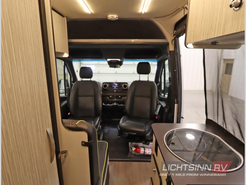 and rear storage box.|RV rental: Rear view of white camper van with open doors — photo 9