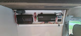 RV rental van's power system: Redarc manager, 2000W inverter, fuse box, and wiring for robust off-grid use.