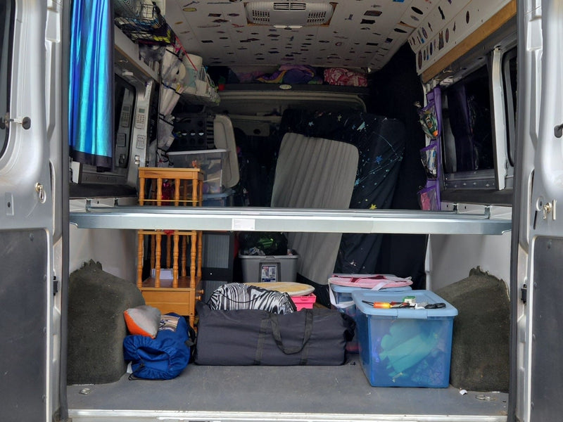  providing a clear view into the van's interior and bug protection.|Smiling woman inside an RV rental — photo 7