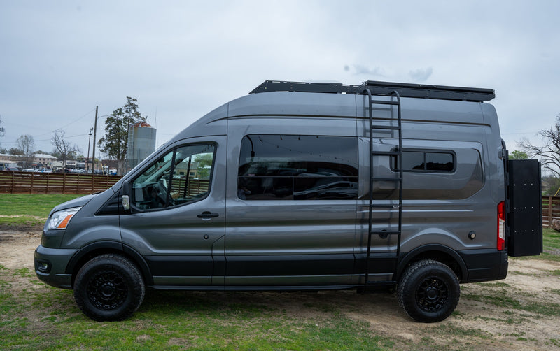 A custom gray Ford Transit camper van — photo 1