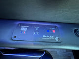 This RV rental's Twin Air climate control panel shows digital temperature, fan speed, and climate mode for interior comfort.