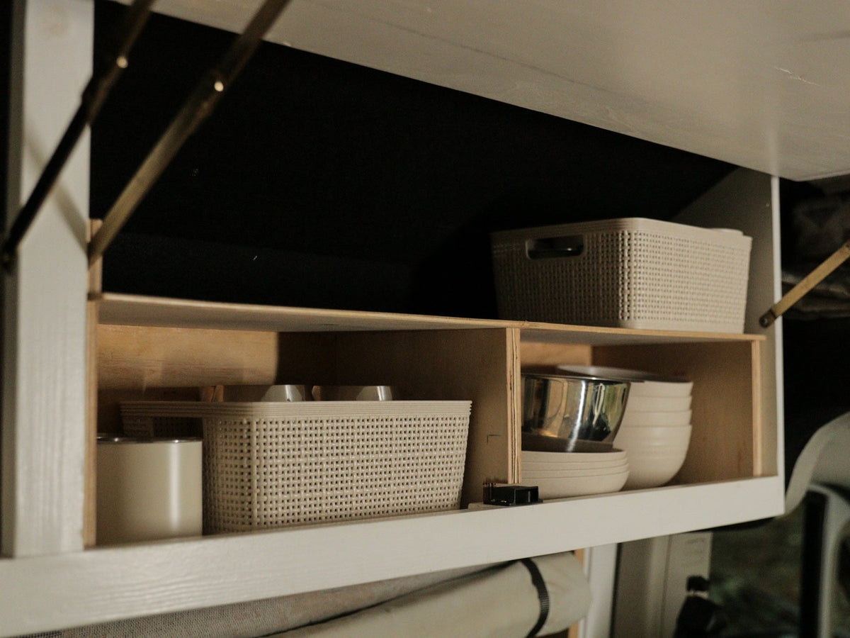  and a stove on the left.|RV rental van interior: swivel front seats — photo 16