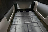  and picturesque mountain views.|Luxury RV rental interior: gray convertible bed