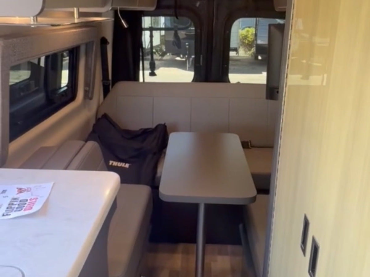  and stunning waterfall views.|This RV rental's compact kitchen features a sink — photo 3