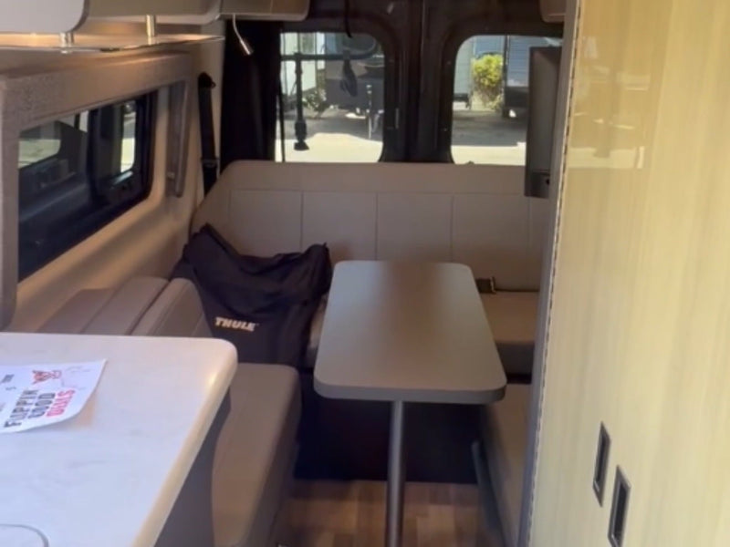  and stunning waterfall views.|This RV rental's compact kitchen features a sink — photo 3