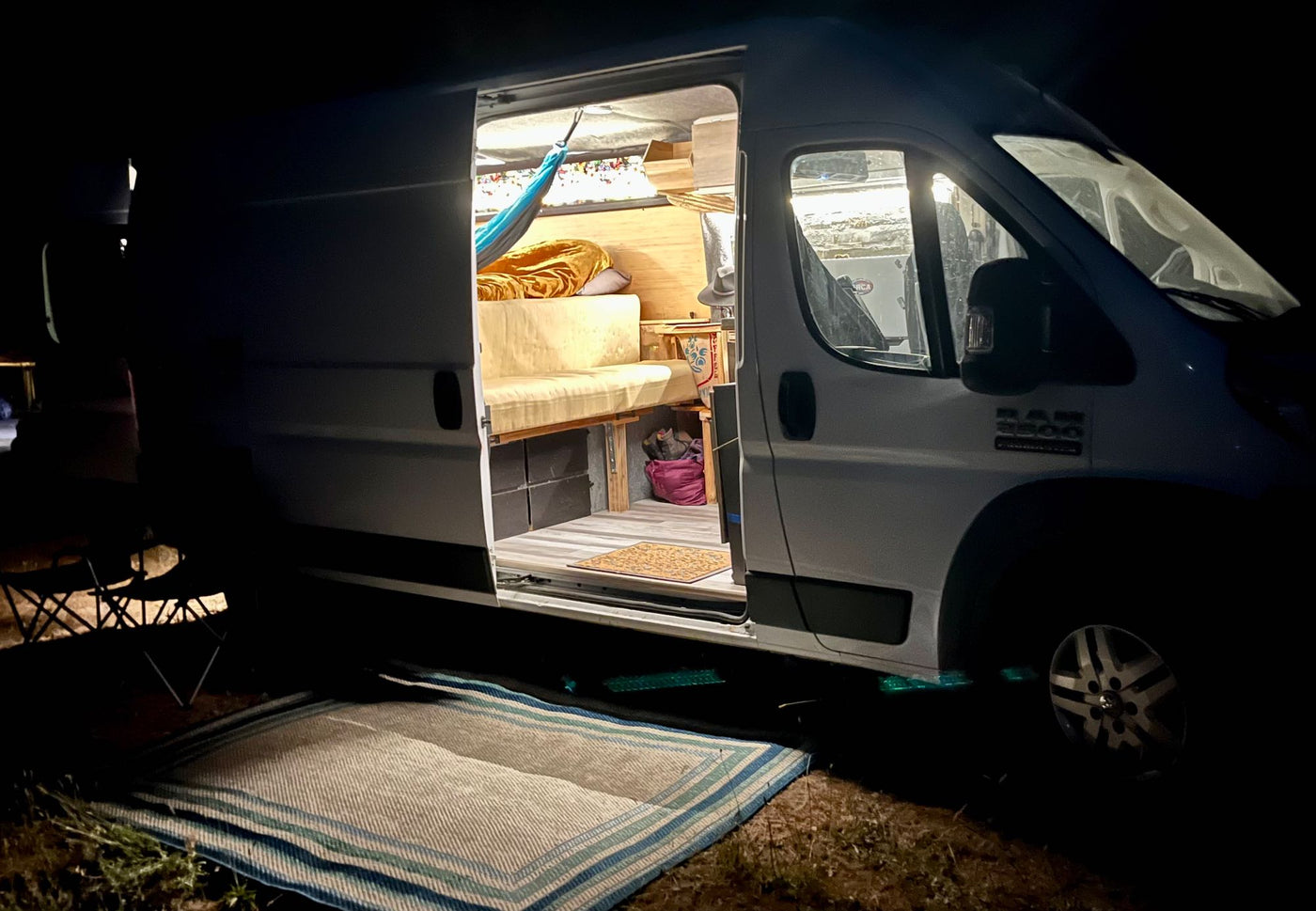  and kitchenette make it a perfect mobile home.|Cozy RV rental camper van interior with a comfy bed — photo 9